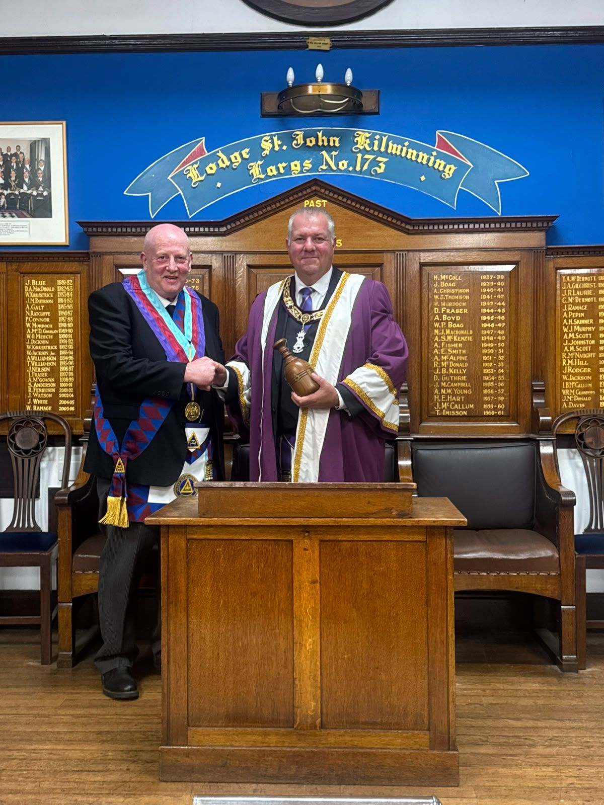 Provincial Grand Superintendent Samuel Tremble congratulates Gordon Hind